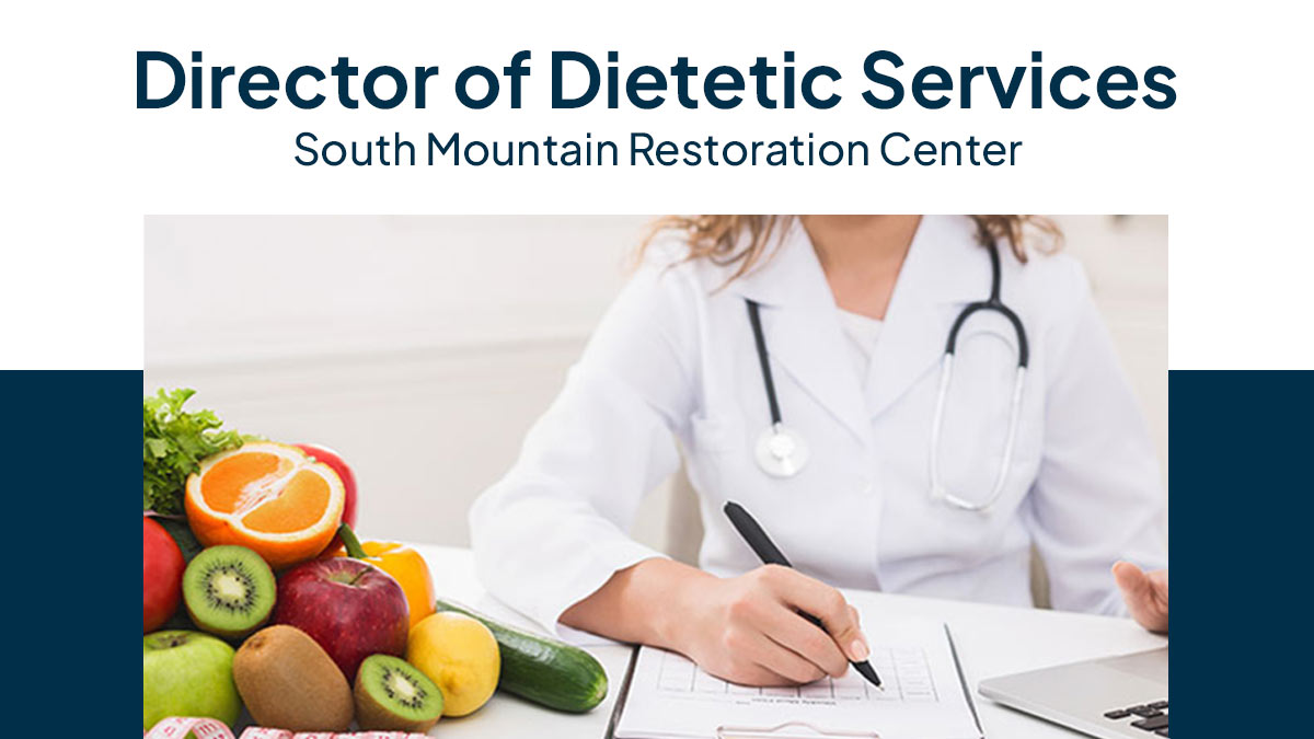 A healthcare worker with fruits and vegetables. 
