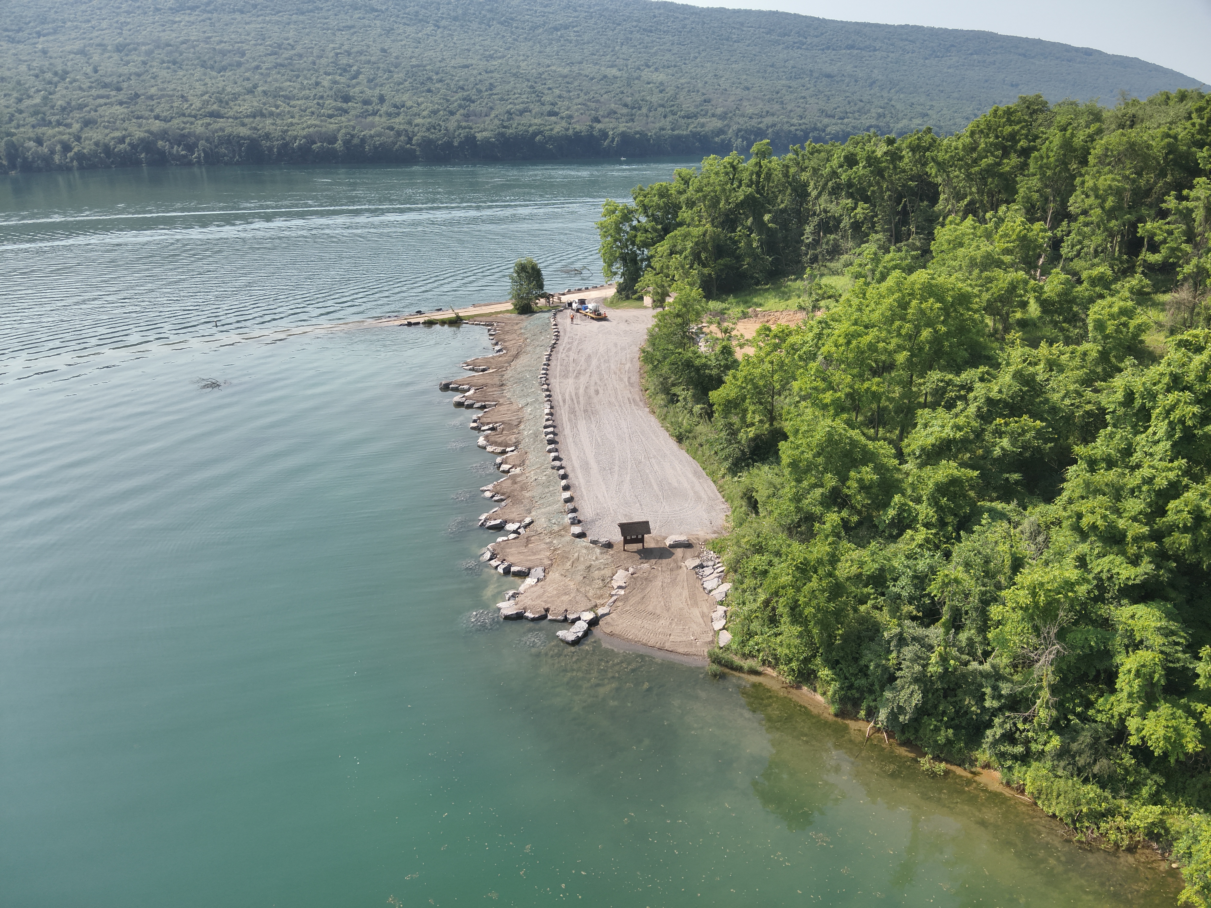 An aerial view of the newly stabilized shoreline made of rocks and large boulders along Hunters Run Cut Shoreline at Bald Eagle State Park.