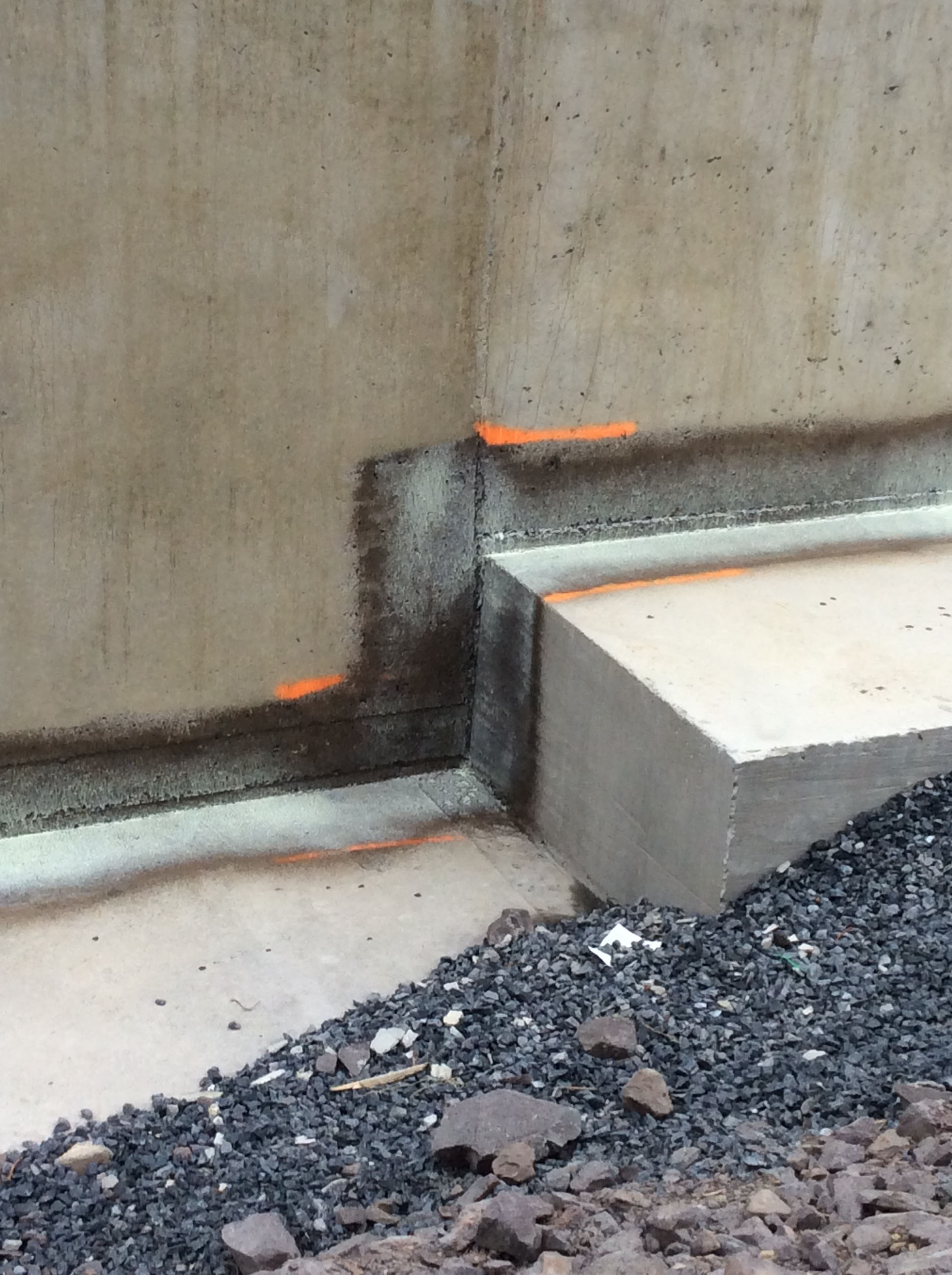 An image of a side of a concrete bridge.