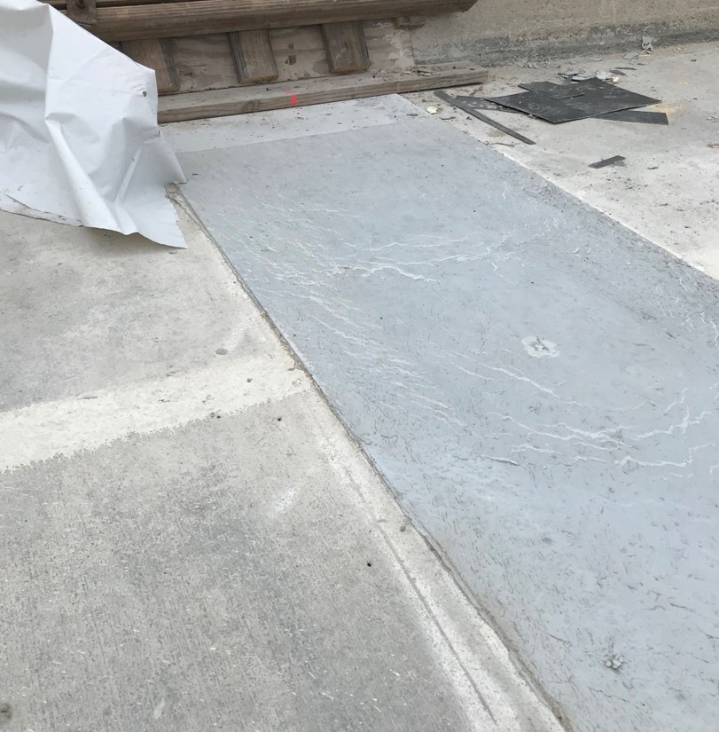 Bridge deck link slab placed on bridge using Ultra-High Performance Concrete.