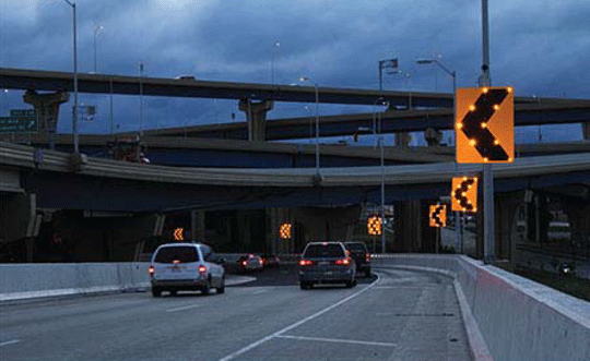 Sequential Dynamic Lighting Curve Warning System along road in the dark.