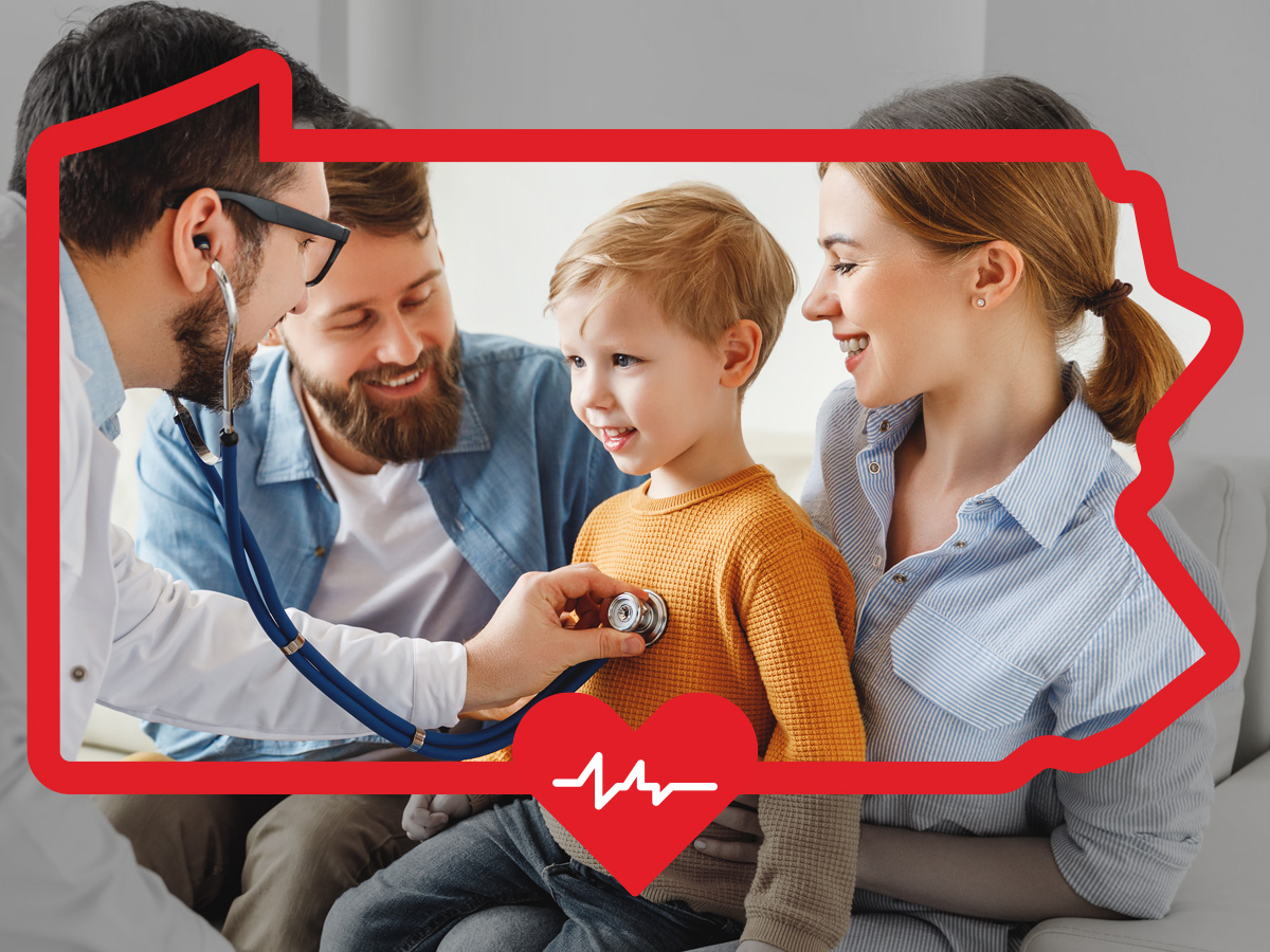 Young boy smiling during a medical checkup with his parents inside the PA state frame.