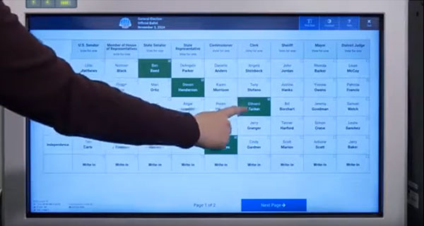 Person making selections on the ballot marking device touchscreen